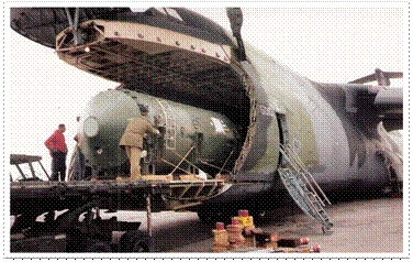 Figure 2:     TOPAZ-II reactor in shipping container being loaded on a United States Air Force               C-5 in St. Petersburg, Russia, April 1992.